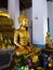 Buddha statue with enormous gold leafs.