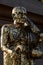 Buddha statue with enormous gold leafs.