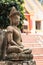 Buddha statue in front of entrance to Buddhist temple