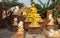 Buddha statue and laughing little monks near Buddhist temple