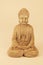 Buddha statue sitting down with legs crossed in prayer