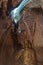 Buddha statue and sunbeams in motion in a cave