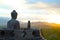 Buddha Statue Watching the Sunset Over Borobodur Temple