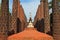 Buddha statues and brick columns in the muangboran museum are a popular tourist