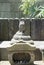 Buddha stone sculpture. A buddha stone sculpture with a snake bo