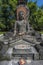 Buddha stone statue in the Bhumisparsha Mudra or gesture. Mendut Buddhist Monastery. Indonesia