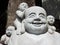 Buddha surrounded by children at the Mileug-Am Buddhist temple. Gimhae, South Korea