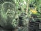 Buddha vestige in green nature at Wat Umong, Chiang Mai, Thailand, green buddha portrait covered with moss