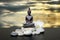 Buddha,zen stone,white orchid flowers and dark sky and clouds reflected in water