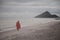 Buddhism monk walking alongside sea