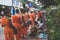 Buddhist alms giving ceremony in the morning. The tradition of giving alms to monks in Luang Prabang has been extended to tourists