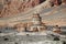 Buddhist chorten against the background of cliffs of Drakmar.