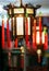 Buddhist decorative lanterns with red tassels hanging outdoors at night as street lighting for Chinese New Year holiday celebratio