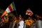 Buddhist Flag carriers walk down the streets of Kandy during the Esala Perahera in Sri Lanka.