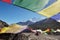 Buddhist flags against the background of snowy peaks