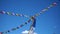 Buddhist flags fluttering in the sky over Ladakh, India