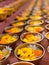 Buddhist flower offerings or gifts in bowls and rows