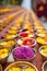 Buddhist flower offerings or gifts in bowls and rows