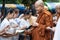 On buddhist holy day Thai buddhist people always go to temple to offer food to monks