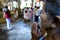 A Buddhist lady offers prayers inside the Temple of the Sacred Tooth Relic in Kandy, Sri Lanka.