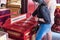 Buddhist make a merit into donation box at Buddha Tooth Relic Temple and Museum