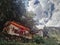 buddhist monastery building with prayer flags flowers