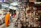 Buddhist monk choosing books in the second-hand bookstore of popular Chatuchak Weekend Market