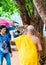 Buddhist monk feeding with milk a Bengal tiger in Thailand