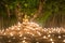 Buddhist monk fire candles to the Buddha with beautiful water reflection in Phan Tao Temple, Chiangmai, Thailand.