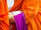 Buddhist monk holding alms bowl and lotus flower