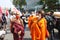 Buddhist monk join protesters march to front government house after riot police crackdown Talu Fah Village