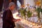 Buddhist monk lighting candles