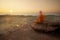 Buddhist monk in meditation at beautiful sunset or sunrise background