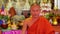 buddhist monk with orange robe pray in temple