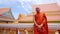 buddhist monk with orange robe pray in temple