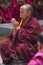 Buddhist monk put his palms together and chanting , Sera monastery , Tibet