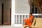 Buddhist Monk Reading Outside a Temple