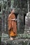 Buddhist Monk Stands at Old Temple of Angkor Cambodia