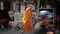 Buddhist monk walking down the street