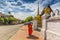 A Buddhist monk walks by the Wat Sen Temple in Luang Prabang, Laos