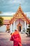 Buddhist monk in Wat Pho temple in Bangkok