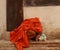 Buddhist monks belongings on a shelf at an ancient temple in Northern Thailand, showing his traditional alms container, some