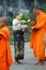 Buddhist monks collecting alms