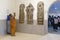 Buddhist monks examine sculptures at Sarnath