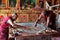 Buddhist monks making sand mandala