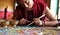 Buddhist monks making sand mandala