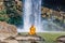 Buddhist monks meditate under a waterfall. Vietnam