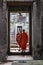 Buddhist monks passing through a stone temple hallway