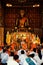 Buddhist monks praying during an afternoon ceremony at their wat