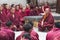 Buddhist monks sitting on the ground and chanting , Sera monastery , Tibet